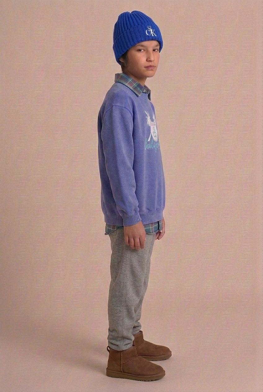 Boy turned farther to the side in the California sweatshirt and faded flannel
